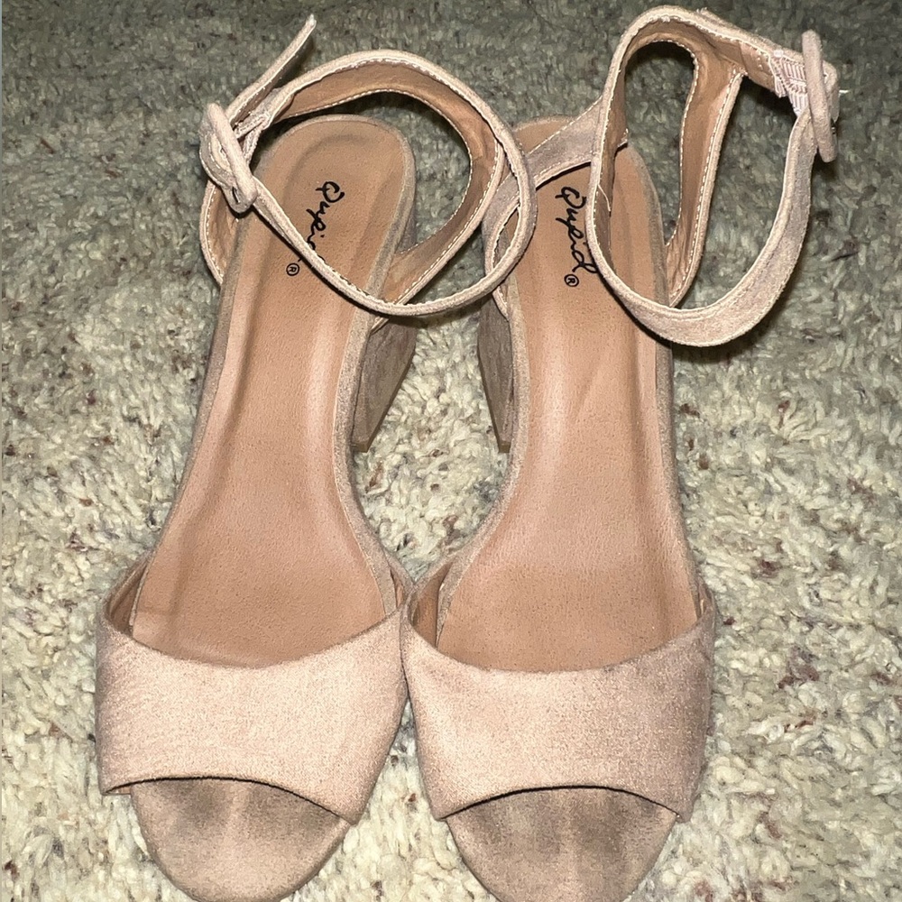 Tan Nude heels with a strap.